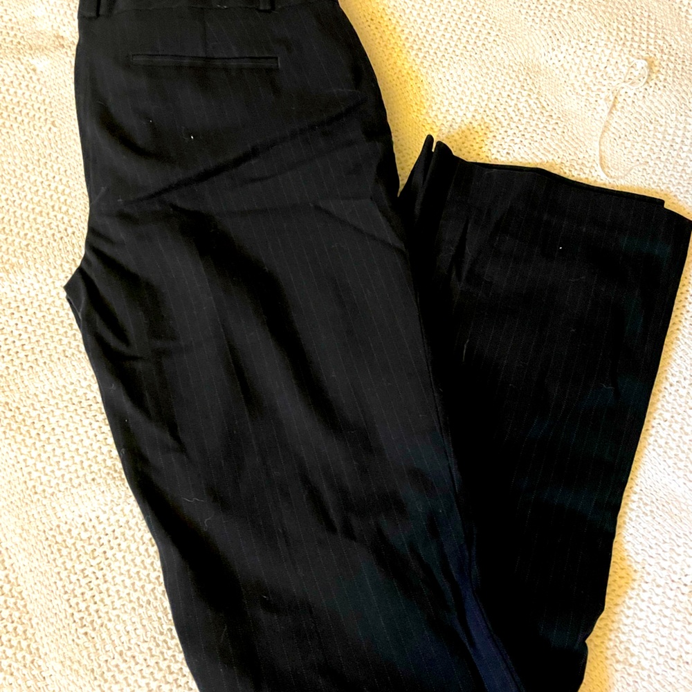 Pinstriped black business pants.
